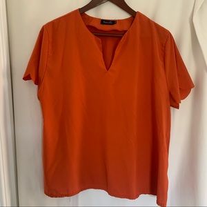 2X women’s pumpkin orange top